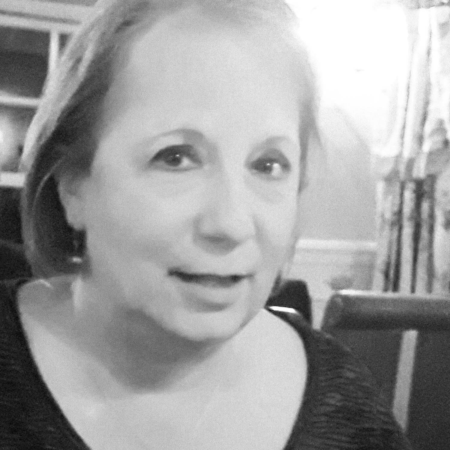 A black and white photograph of the author, Jacqueline Edwards